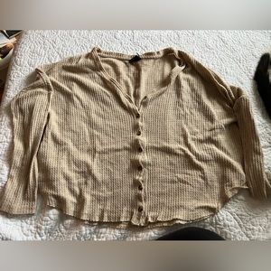 out from under button up sweater.